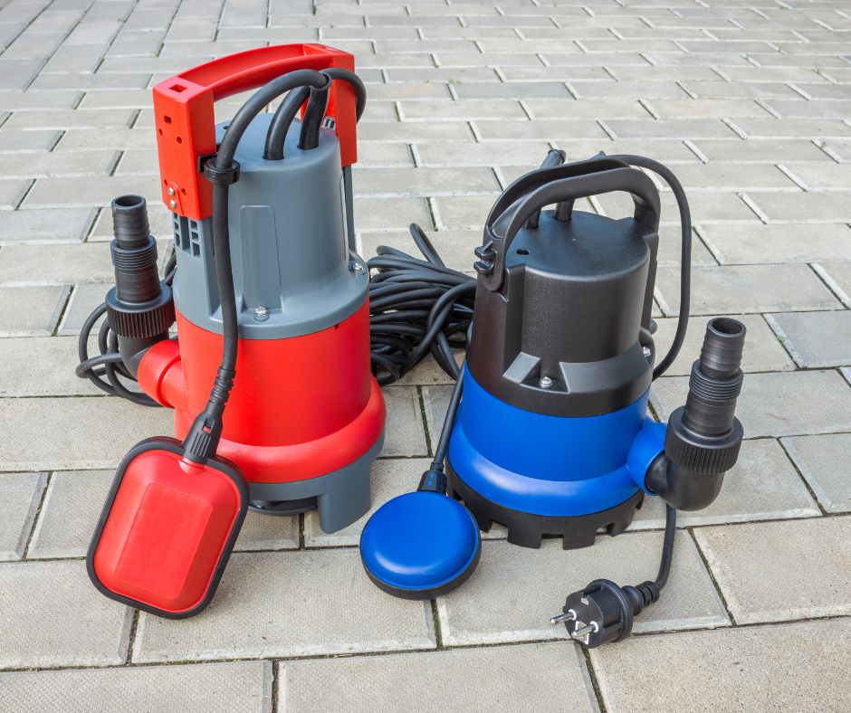 Two submersible water pumps, one red and one blue, with attached cords and float switches, placed on a tiled surface.